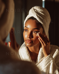 Shimmery light-gold bathrobe towel wrap covering head and shoulders