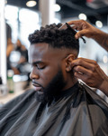 Black hairdressing barber cape with neck fastening, worn during haircut