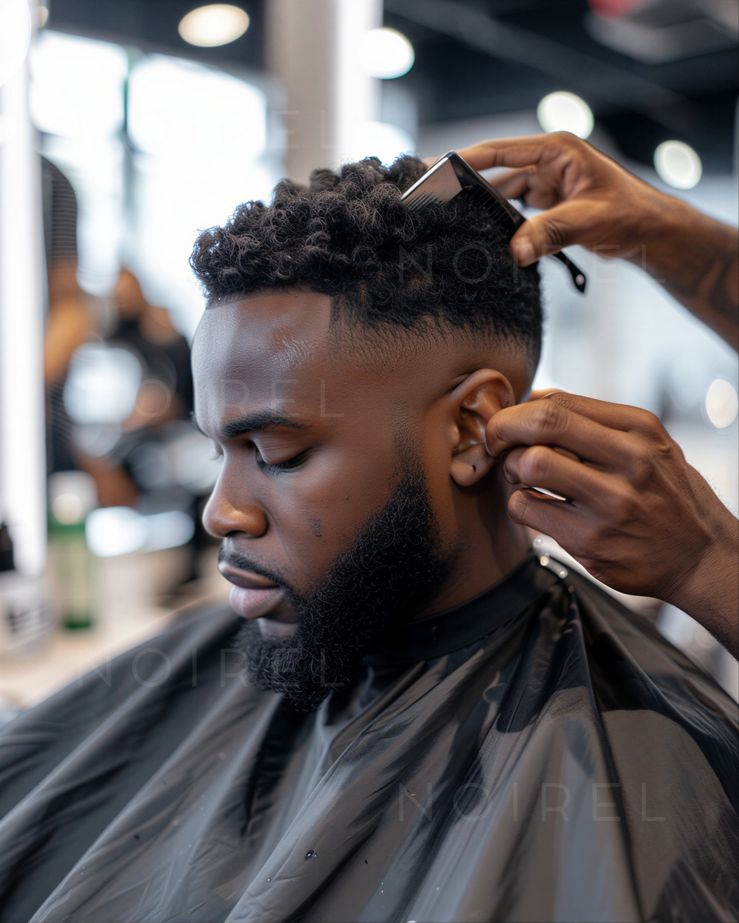 Black hairdressing barber cape with neck fastening, worn during haircut
