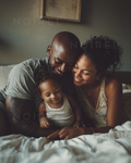 NOIREL NRL221: Family on a bed, parents cuddling the baby