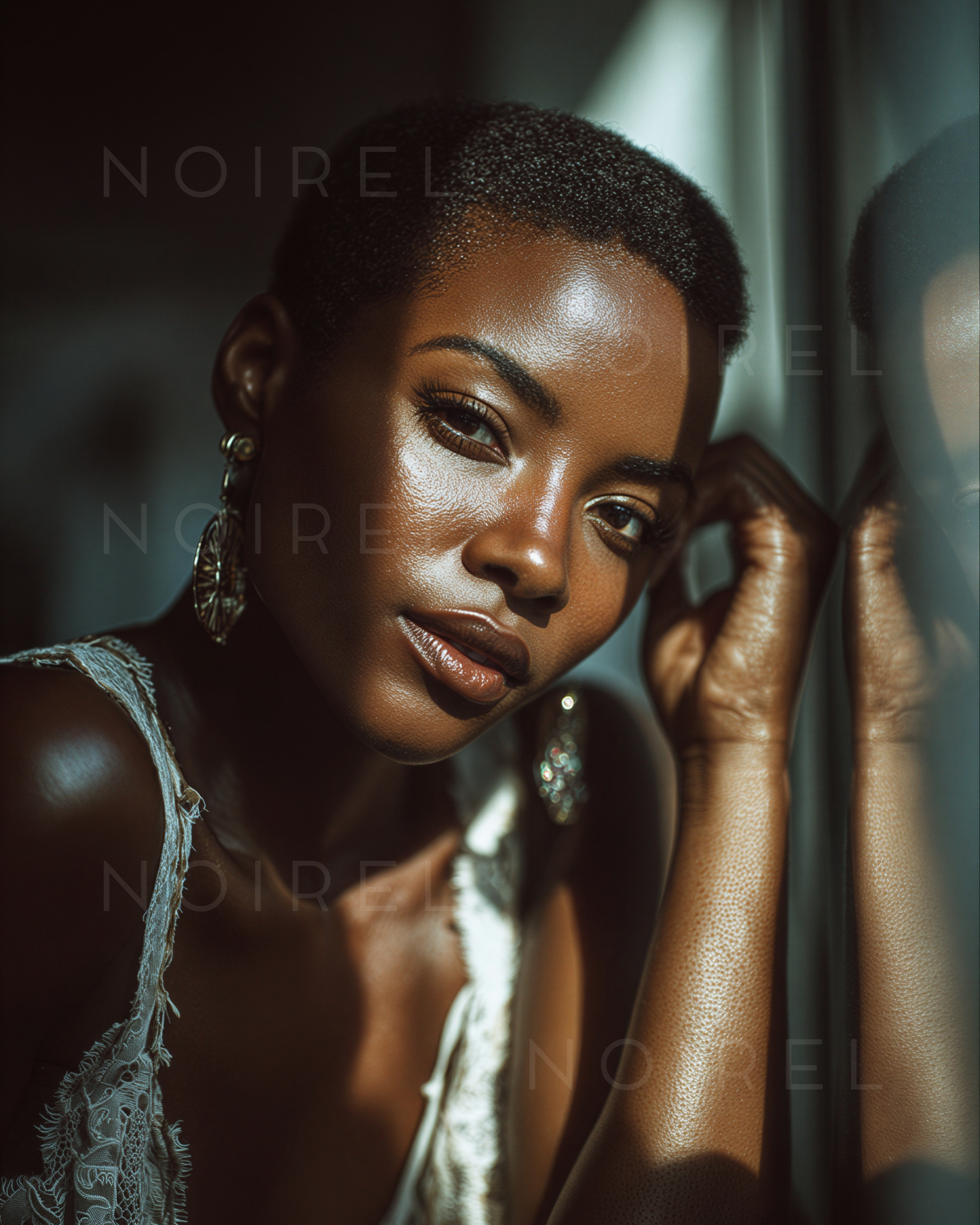 NOIREL Portraits NRL285—close-up woman with short hair and dangling earrings, hand near face