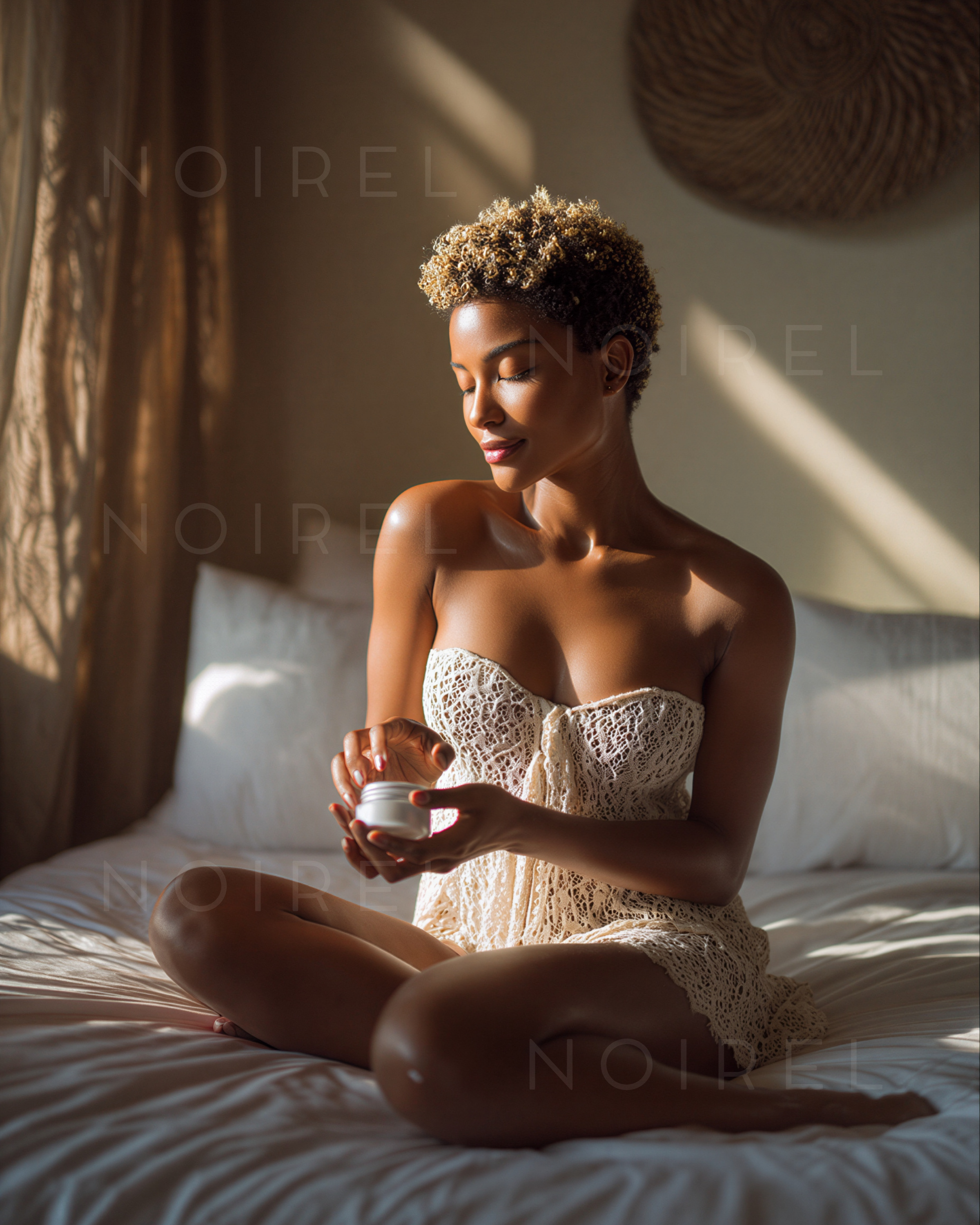 White lace camisole dress, bare shoulders, seated holding a cup